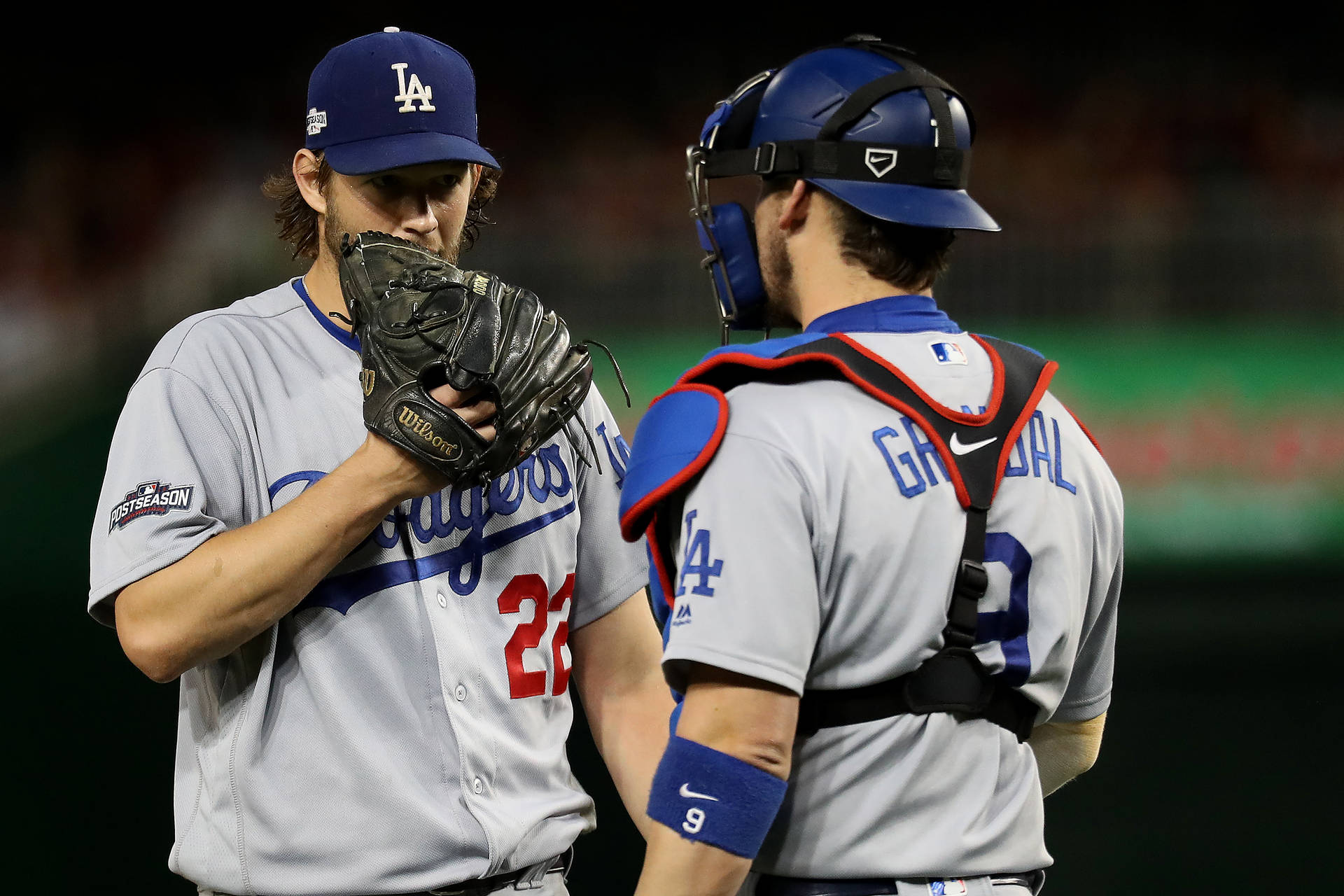 Yasmani Grandal Talking With Pitcher Background