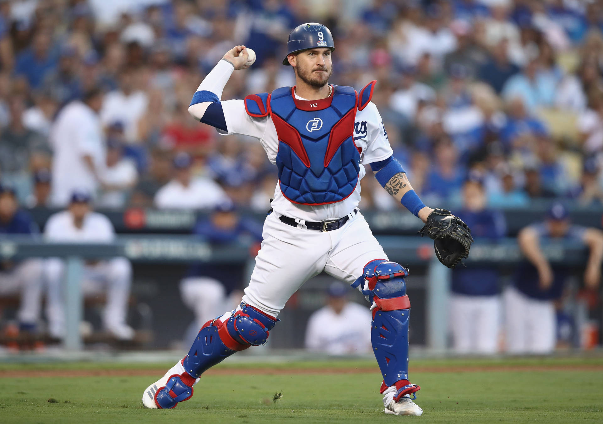 Yasmani Grandal Throwing Baseball As Catcher Background