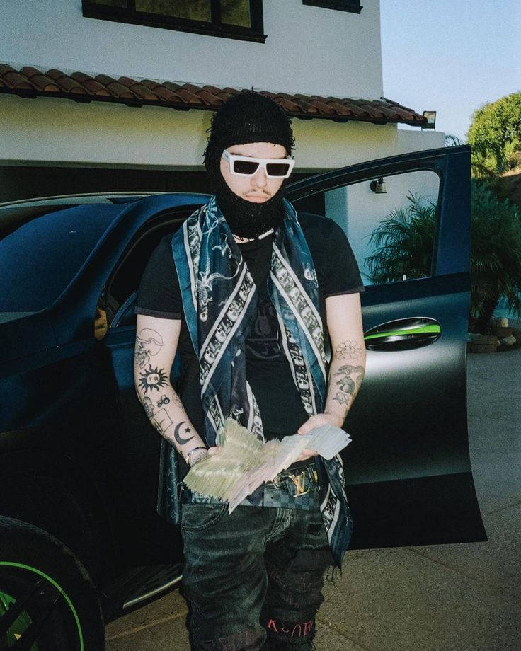 Yeat Holding Cash Beside Black Car Background