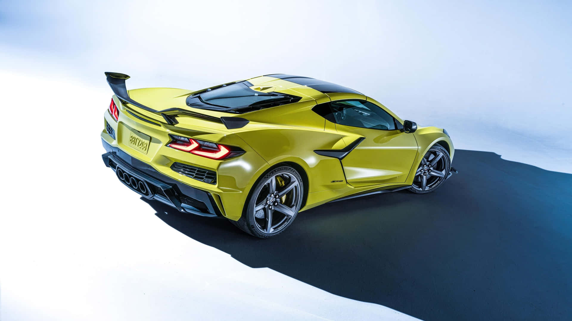 Yellow Corvette C8 Rear View Background