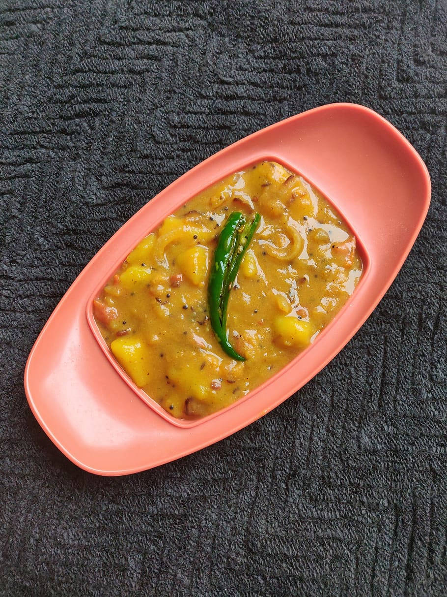 Yellow Curry Topped With Green Chili Background