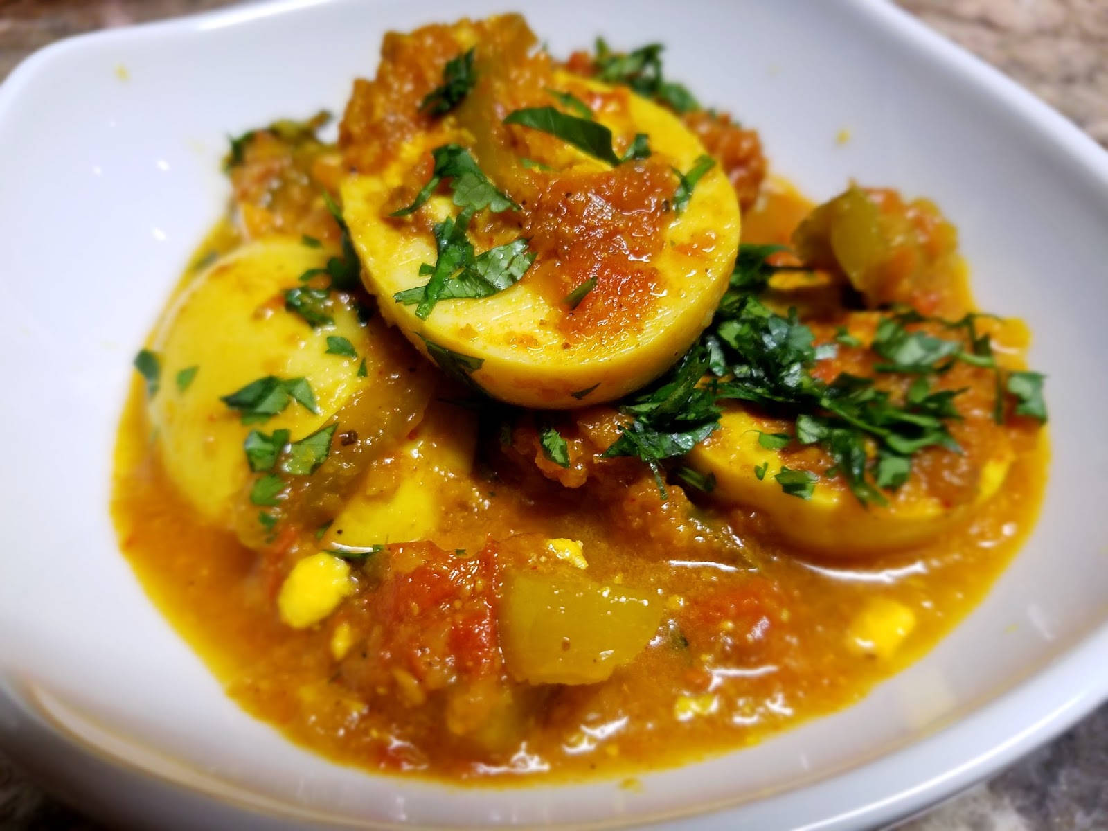 Yellow Curry With Boiled Eggs And Minced Herbs