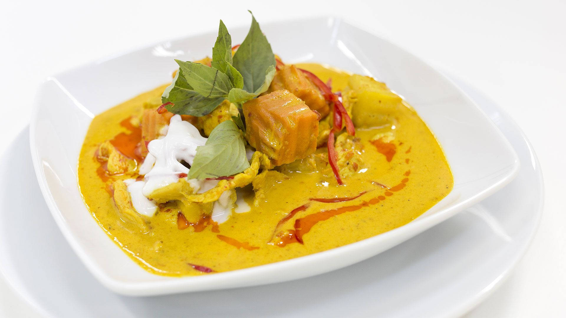 Yellow Curry With Herbs And Cream Background