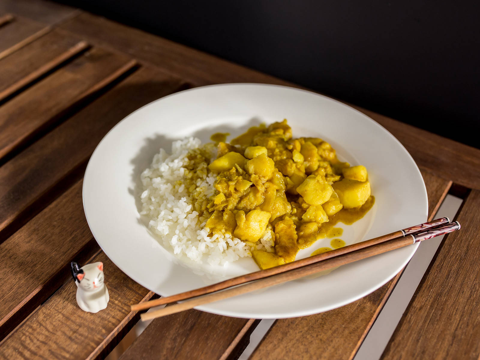 Yellow Curry With Rice And Pair Of Chopsticks