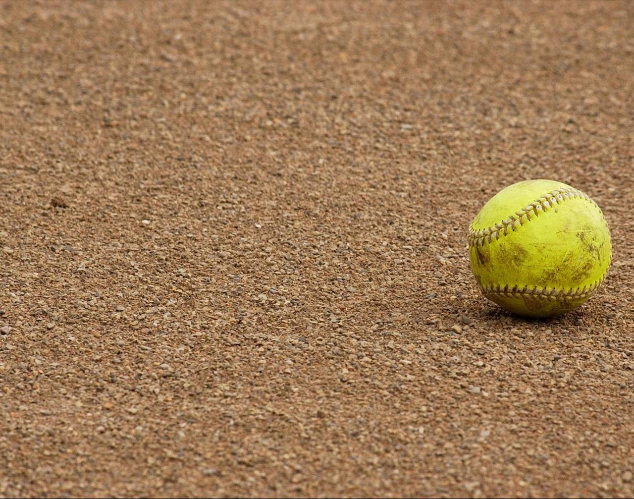 Yellow Cute Softball On The Ground Background