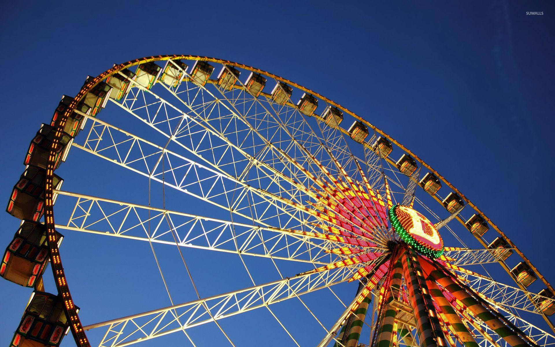 Yellow Ferris Wheel Under Blue Sky Background