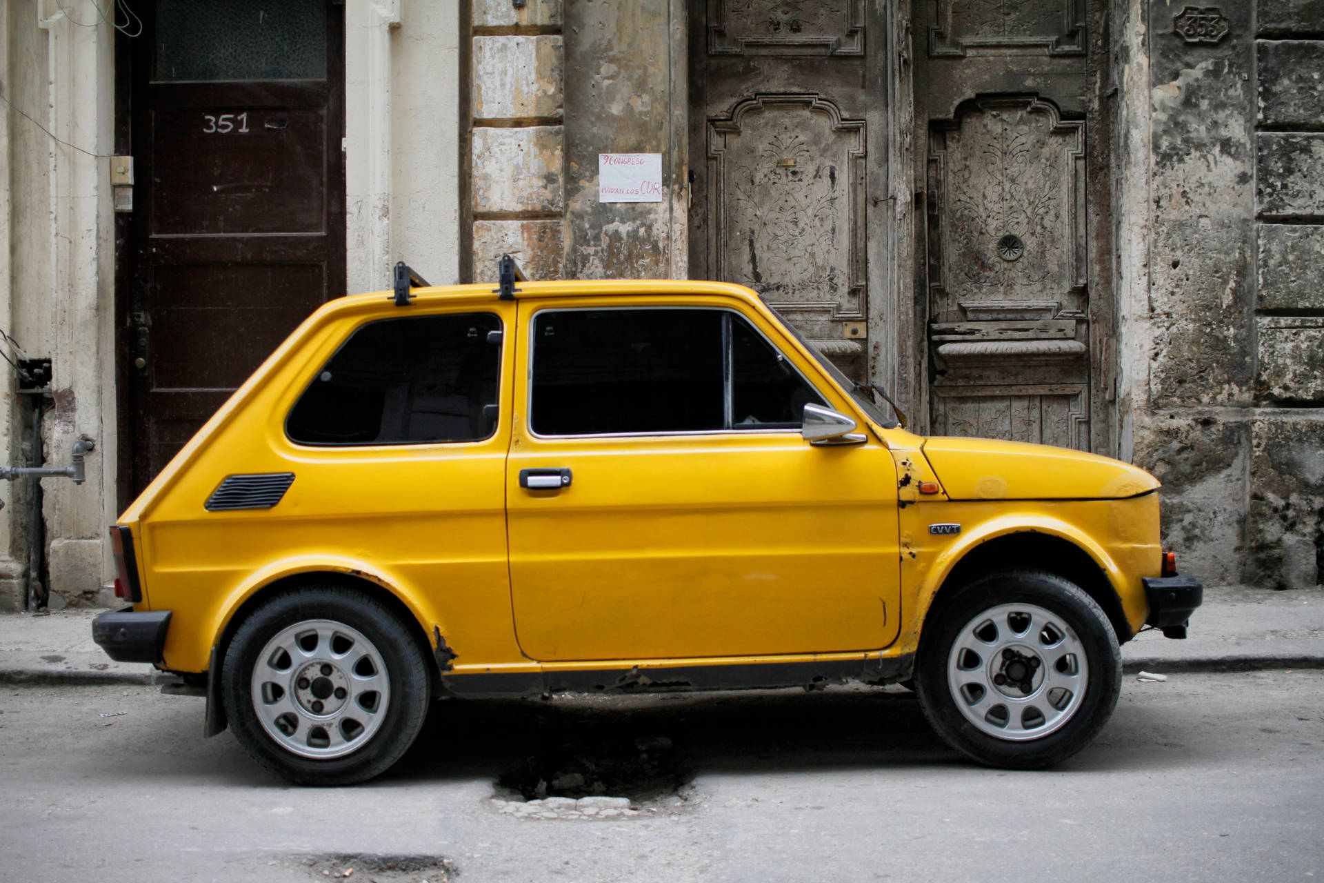 Yellow Fiat 126 In Cuba Background