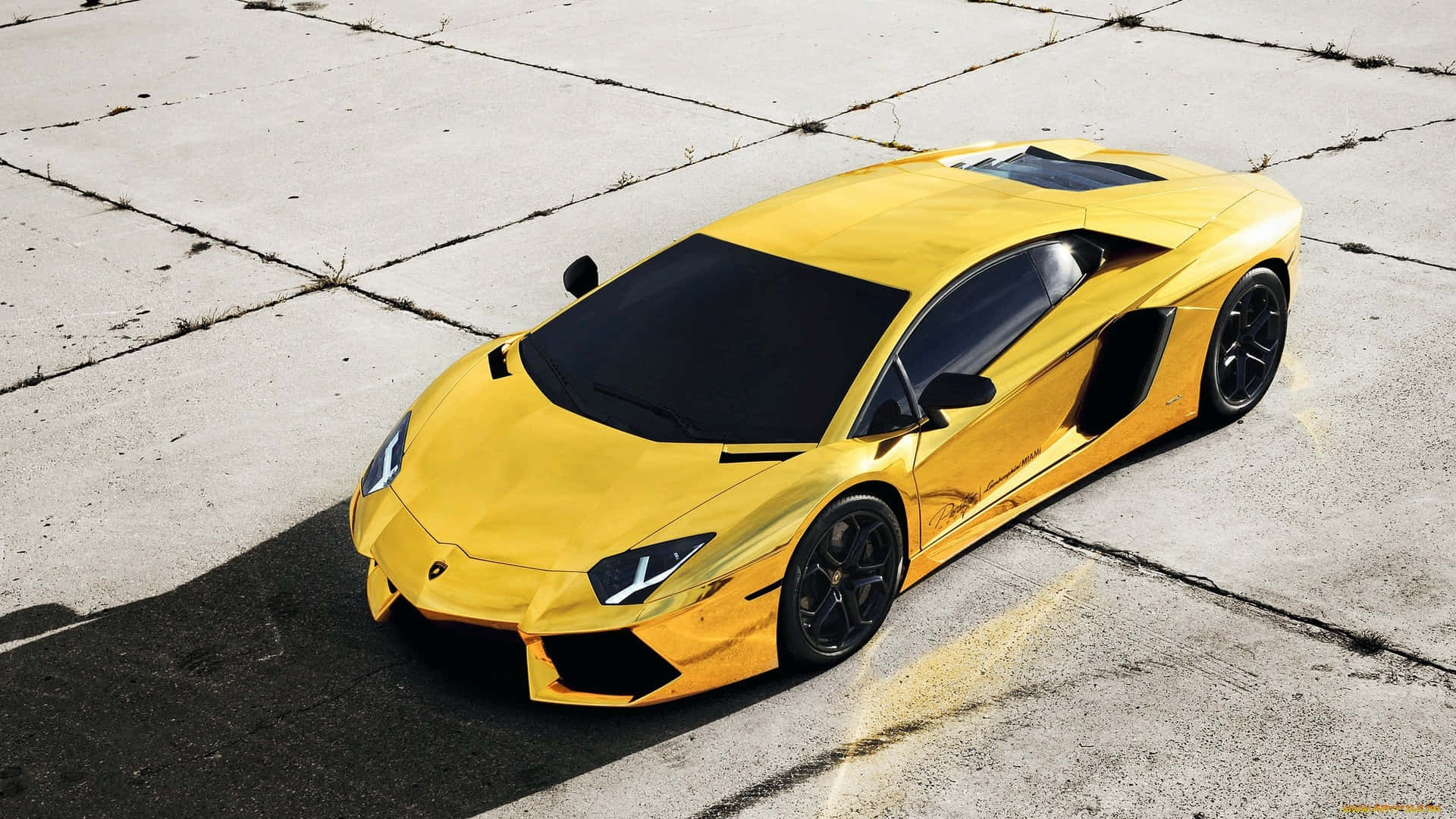 Yellow Gold Lamborghini On Display Background