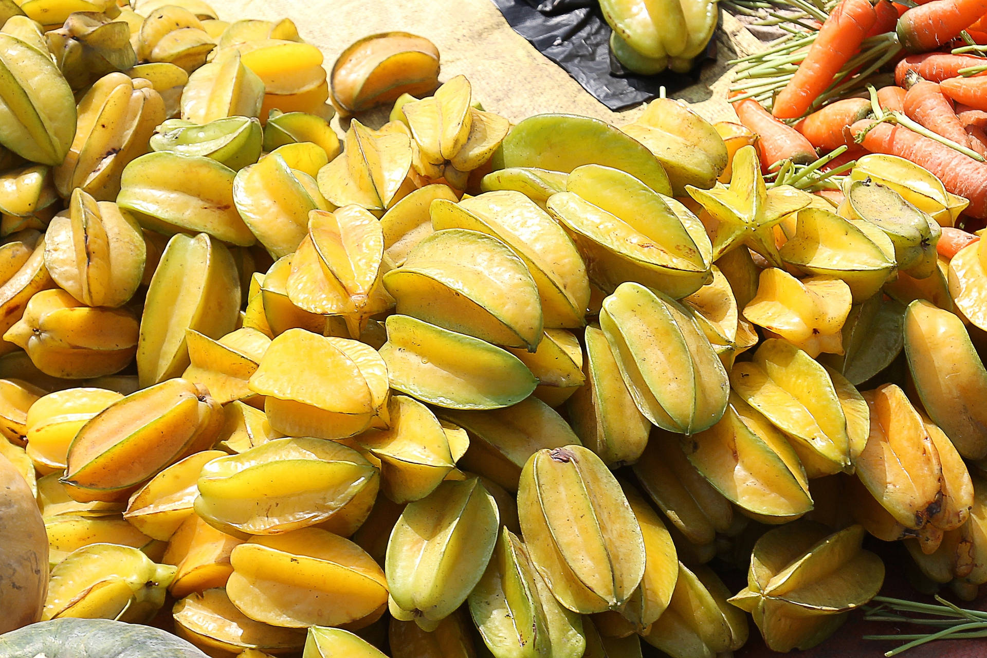 Yellow Golden Carambola On The Ground Background