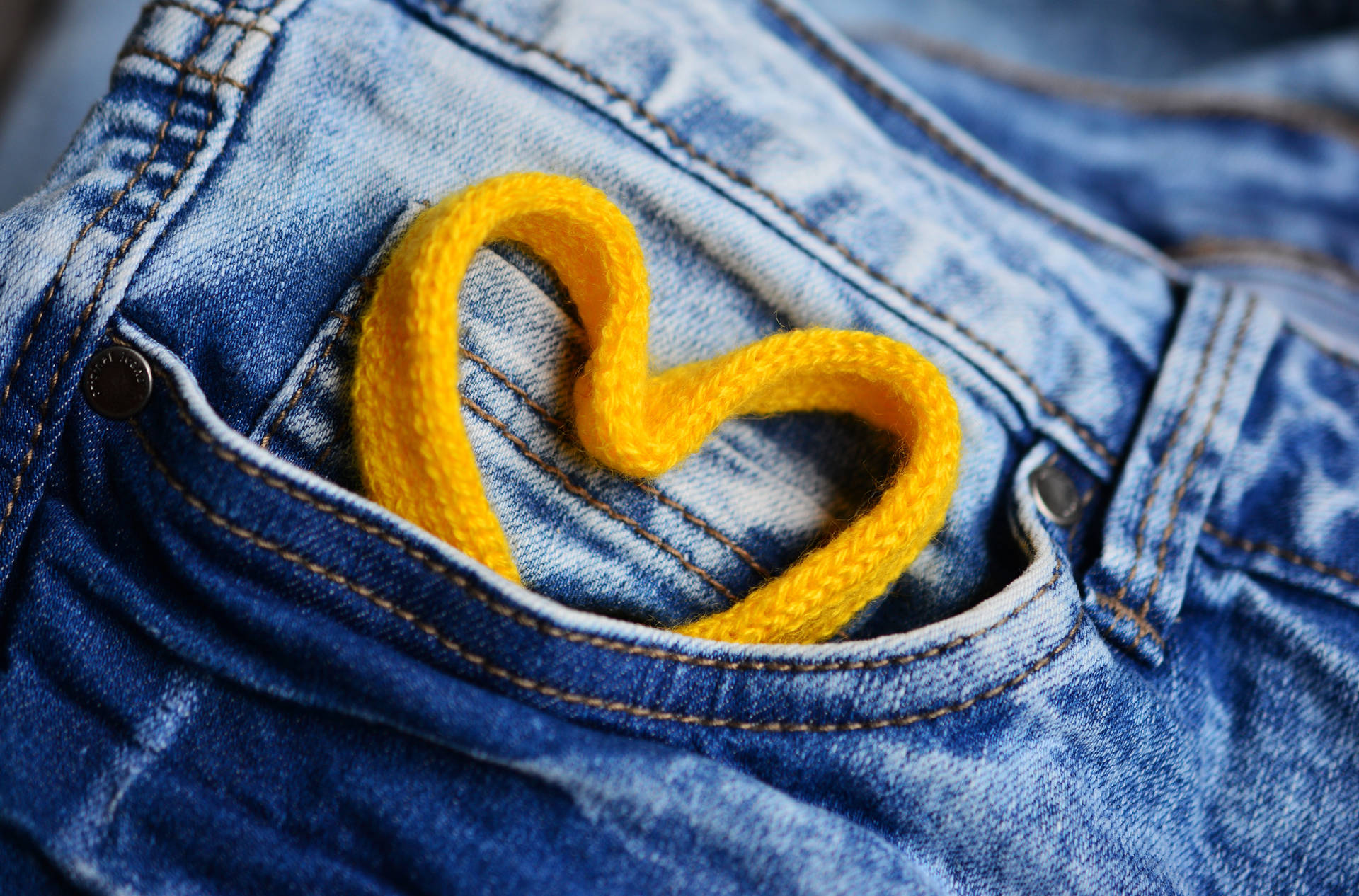 Yellow Lace Heart In Jeans Background