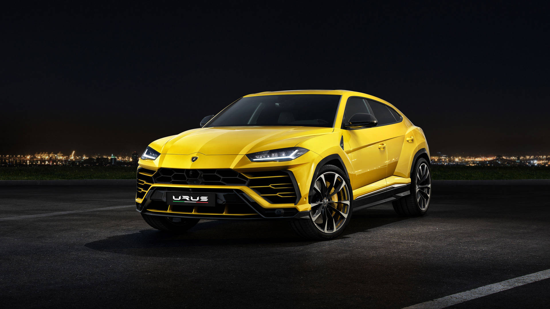 Yellow Lamborghini Urus At Night Background