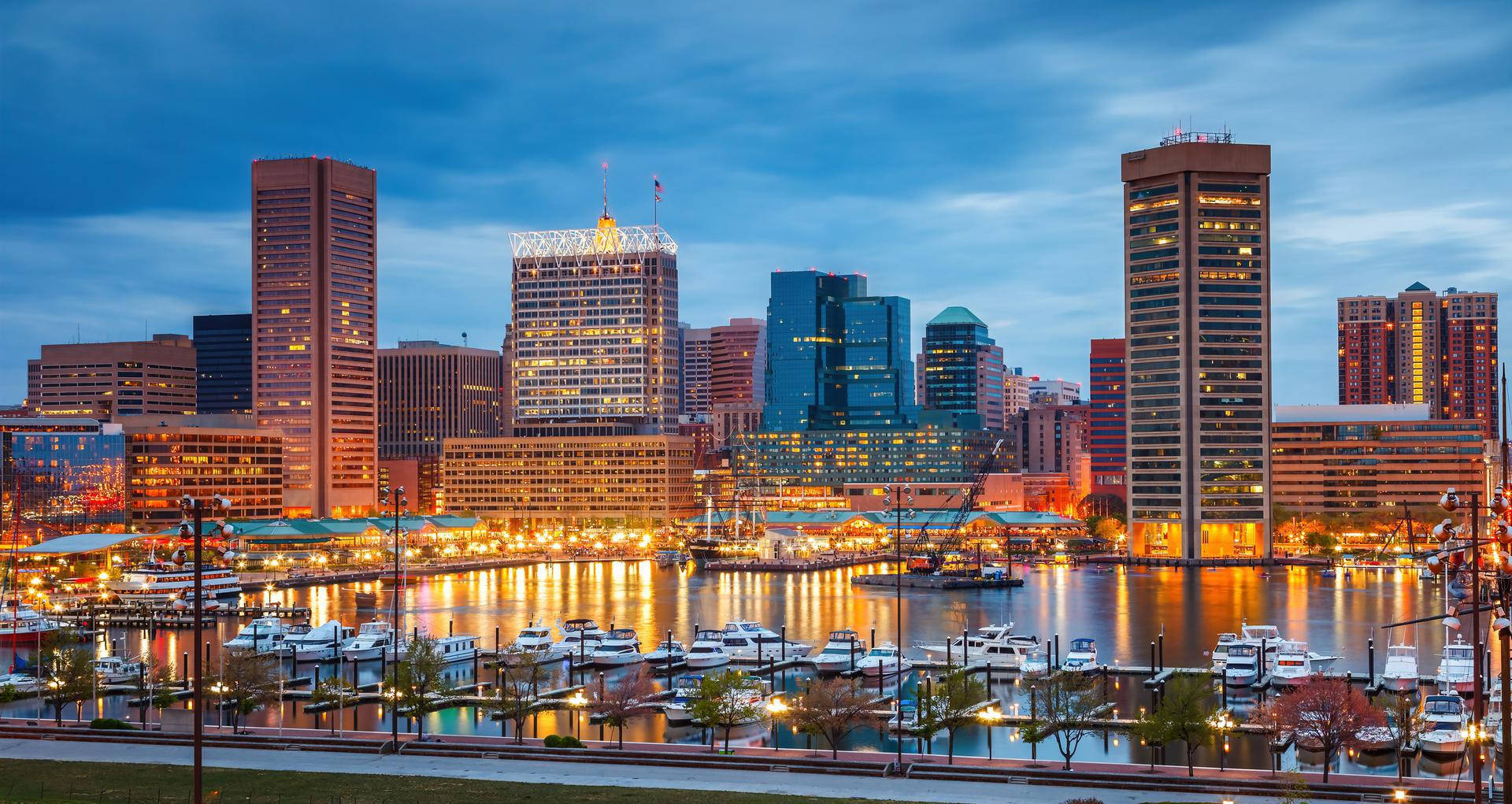 Yellow Lights To The Buildings Of Baltimore Background