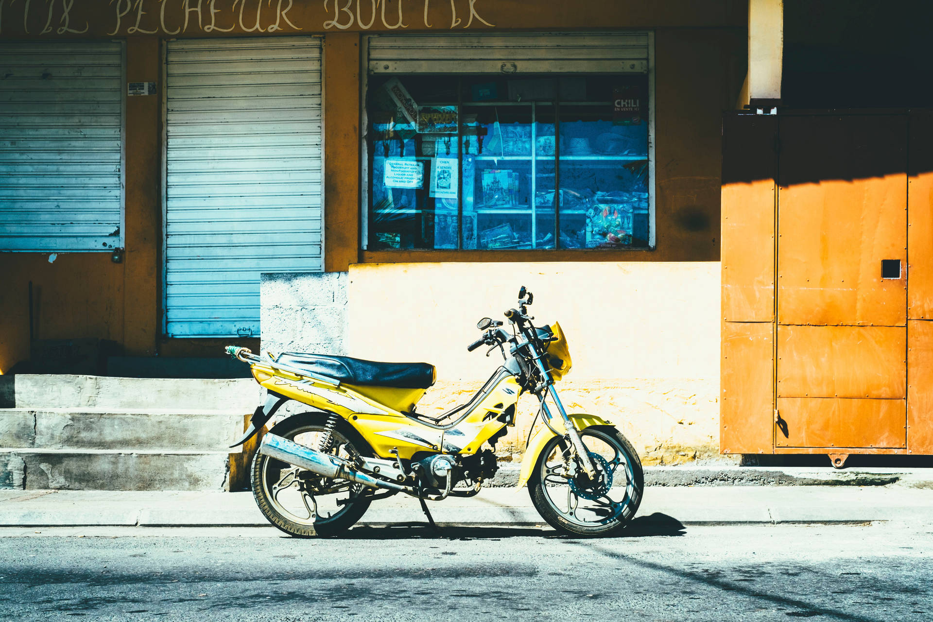 Yellow Motorcycle Near Store Background