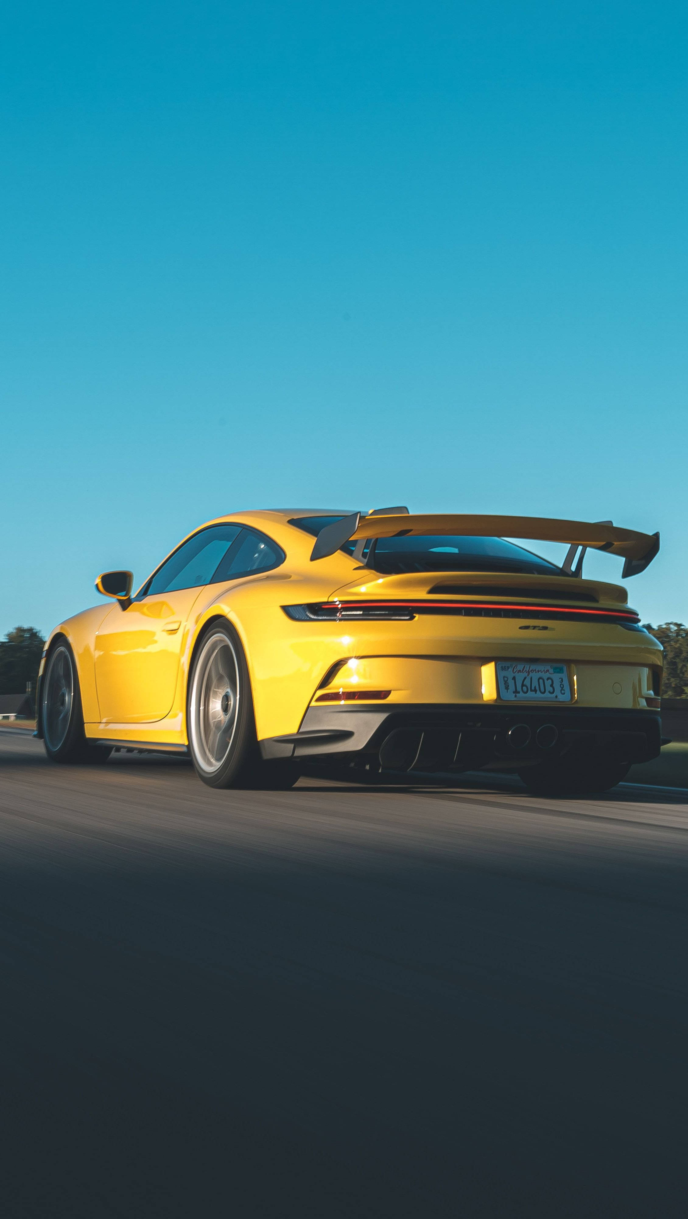 Yellow Porsche 911 Speeding Background