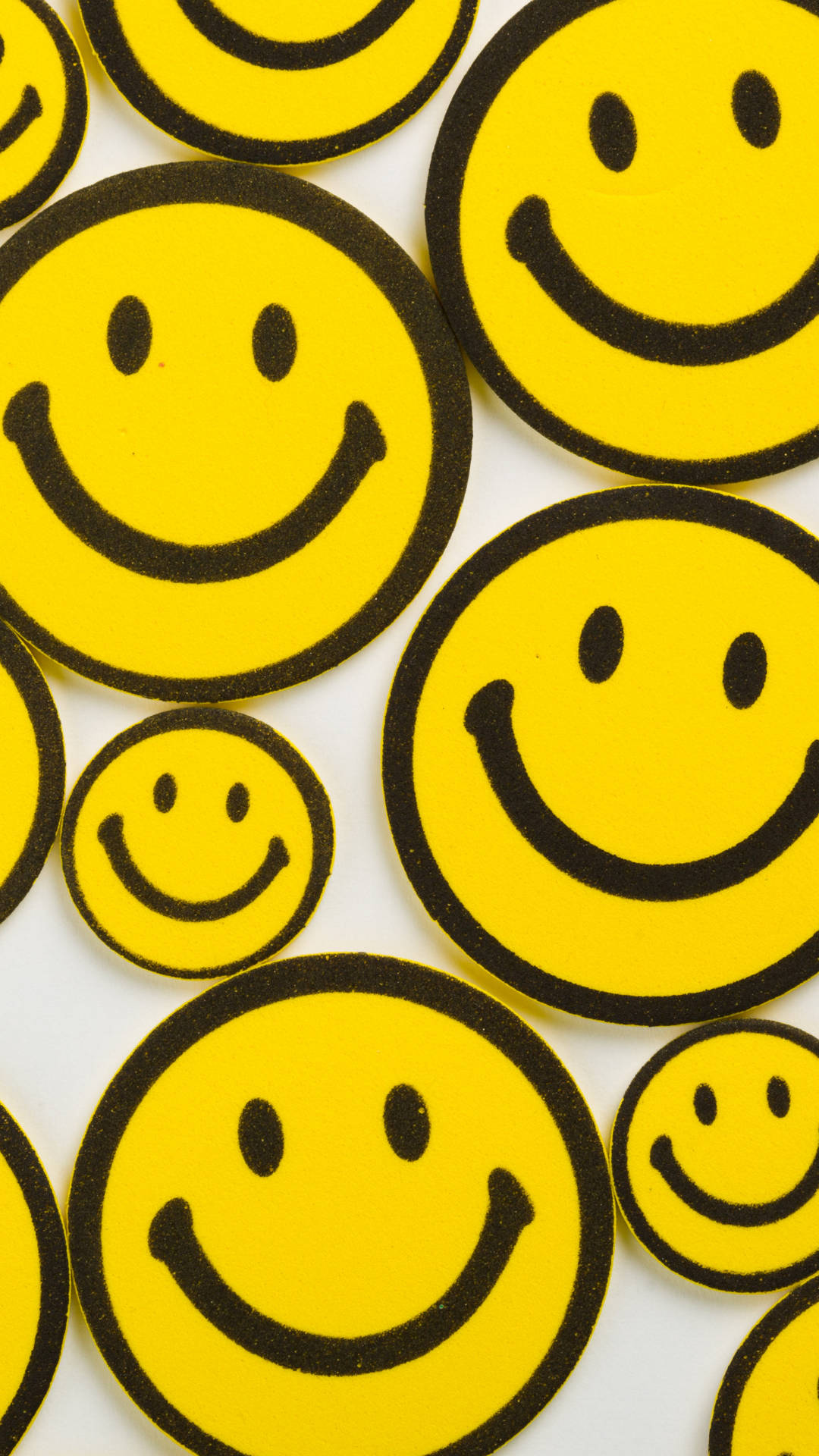 Yellow Rubber Smiley Emojis Background