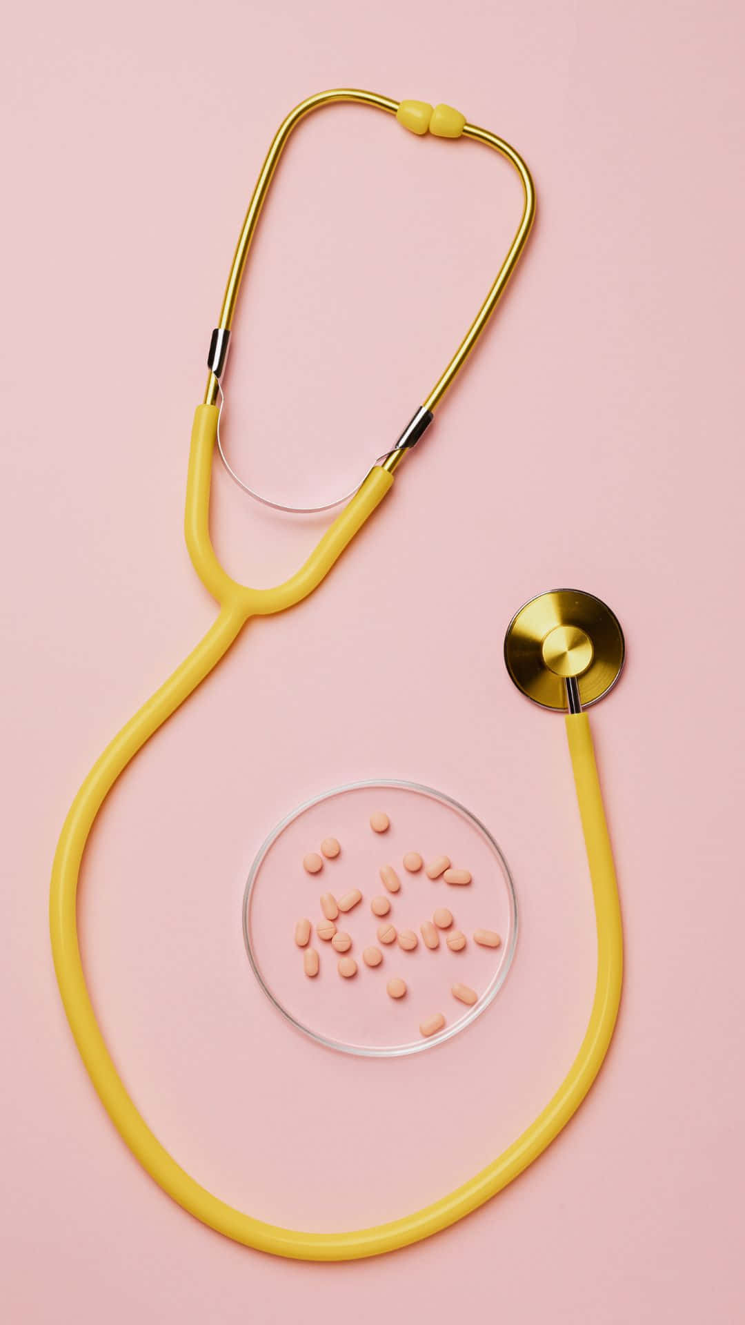 Yellow Stethoscope Pink Pills Pink Background