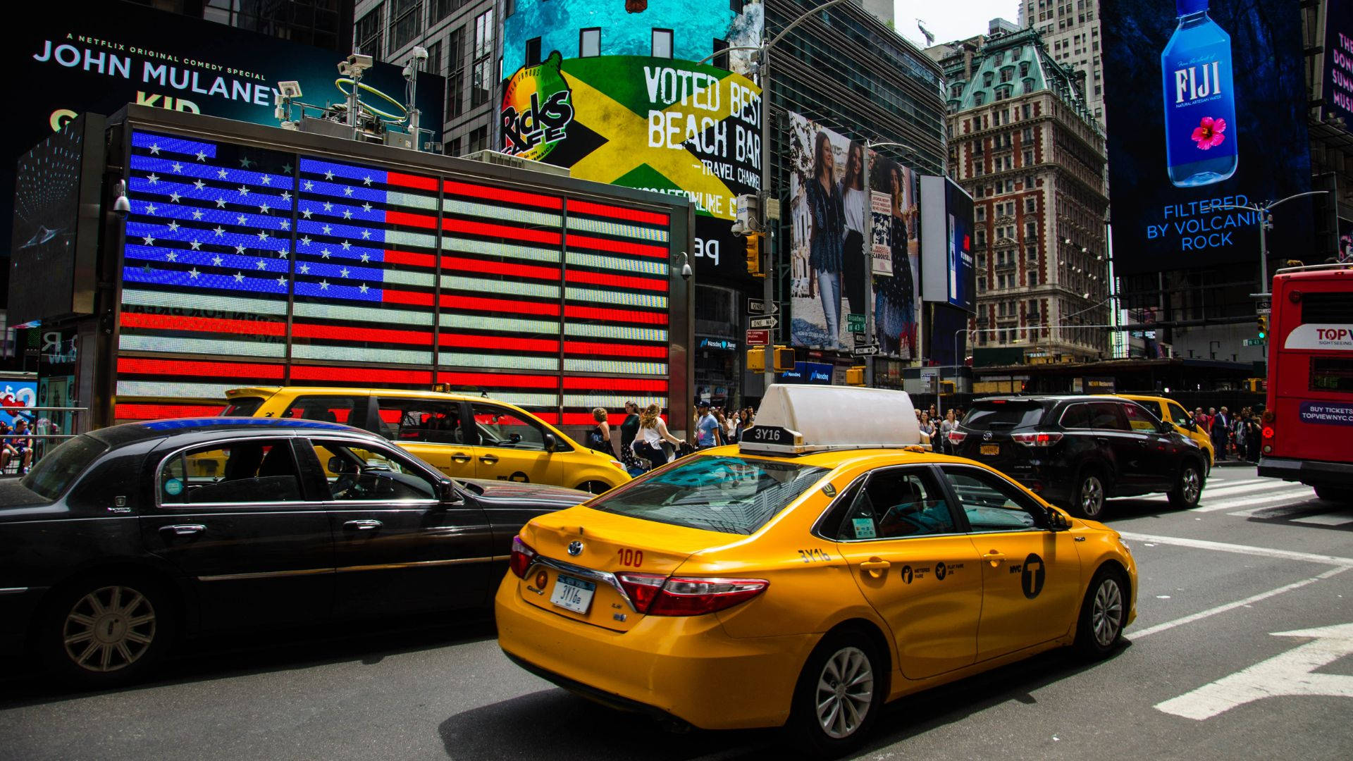 Yellow Taxi Cab In New York City Time Square Background
