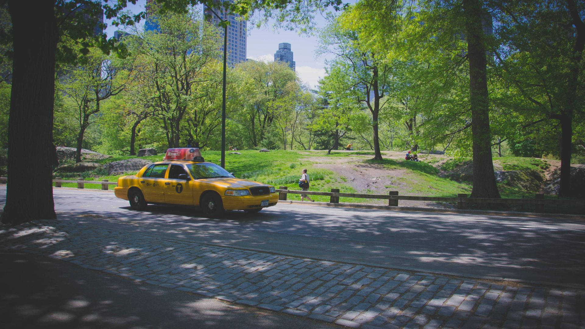 Yellow Taxi In A Serene Park Background