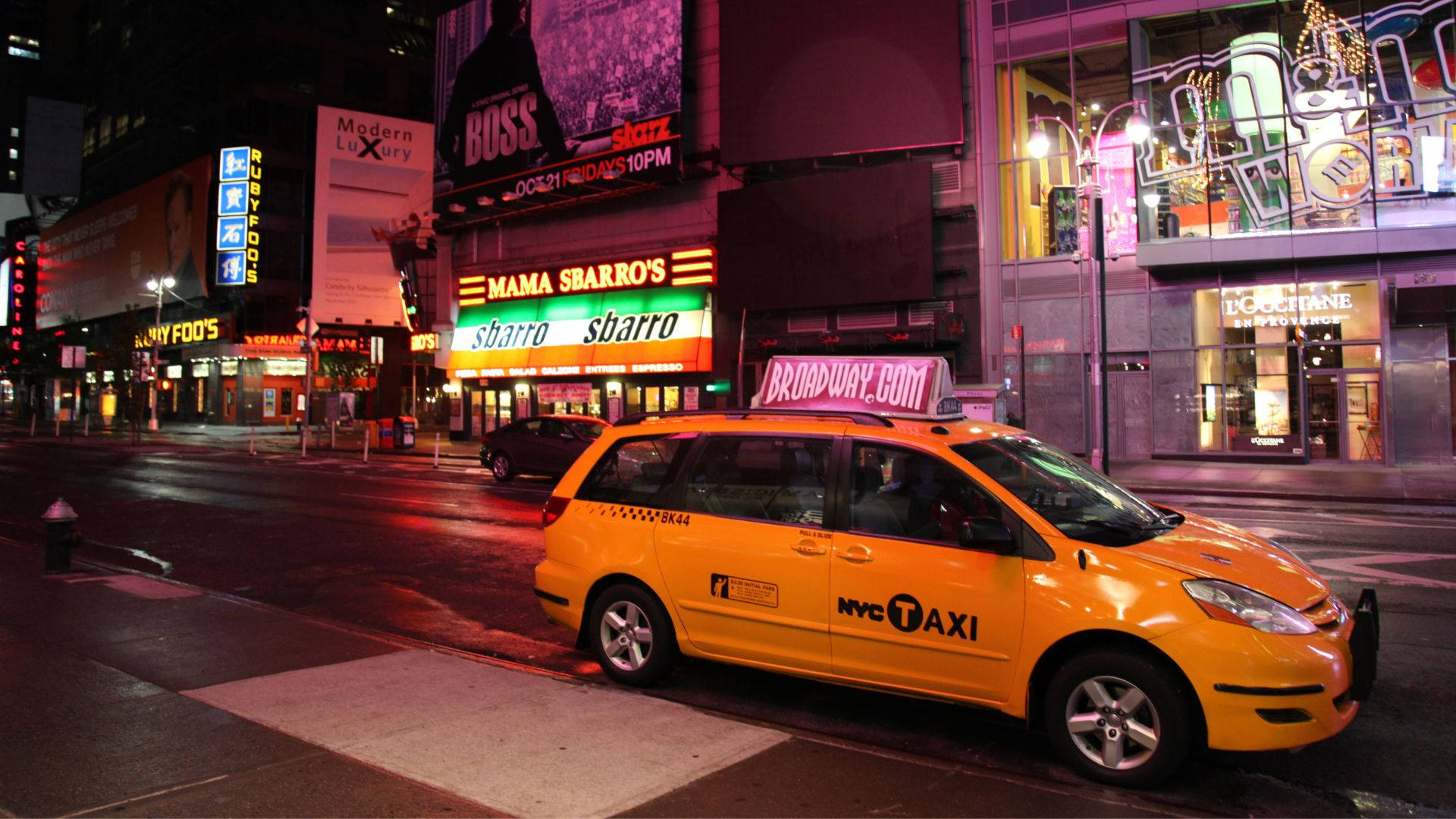 Yellow Taxi Parking In Night City Background