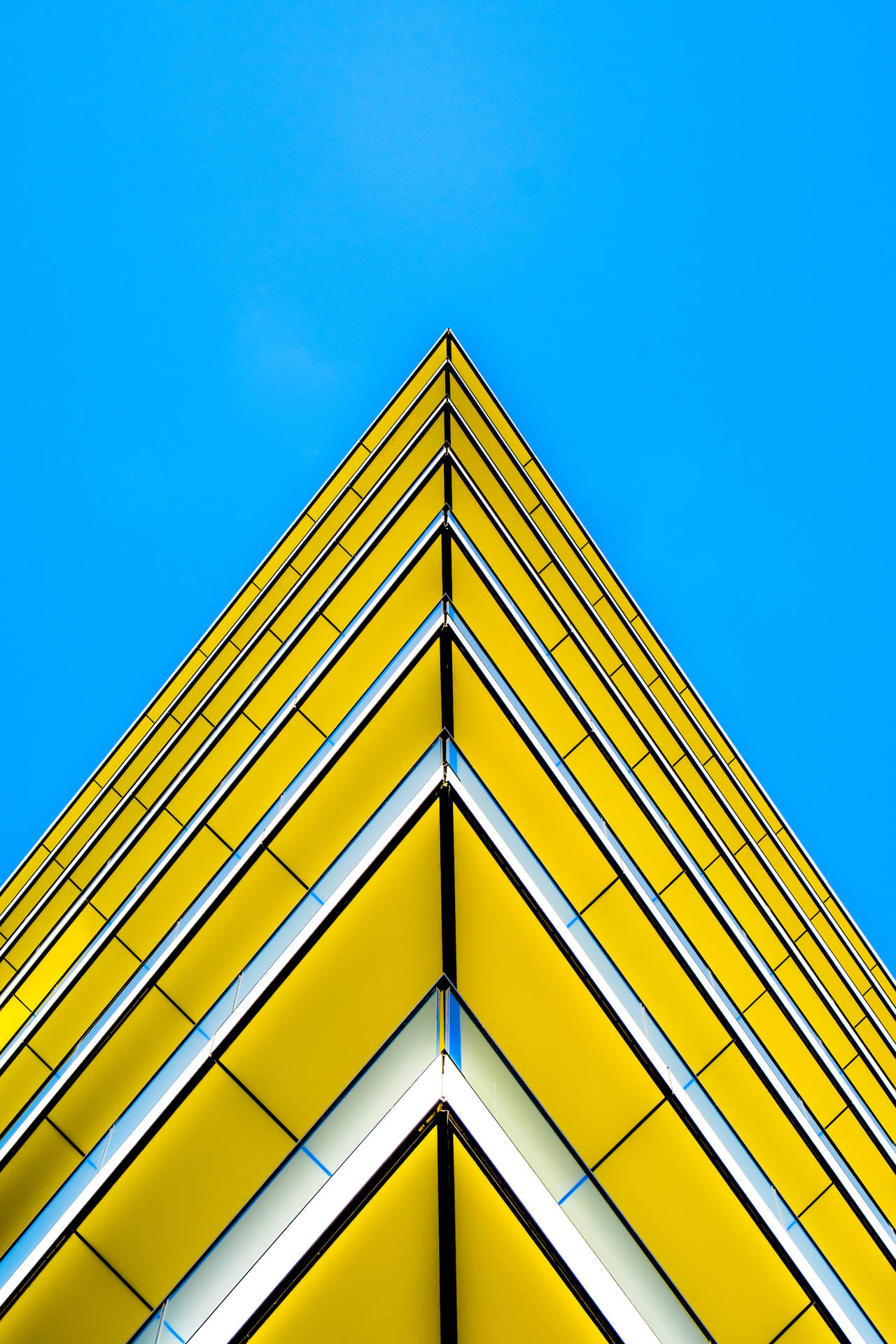 Yellow Triangle Building With Sharp Edges