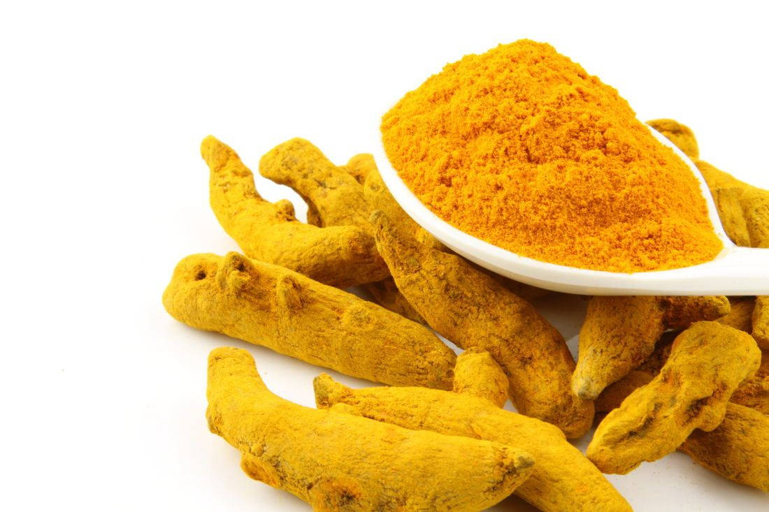 Yellow Turmeric Powder And Rhizomes