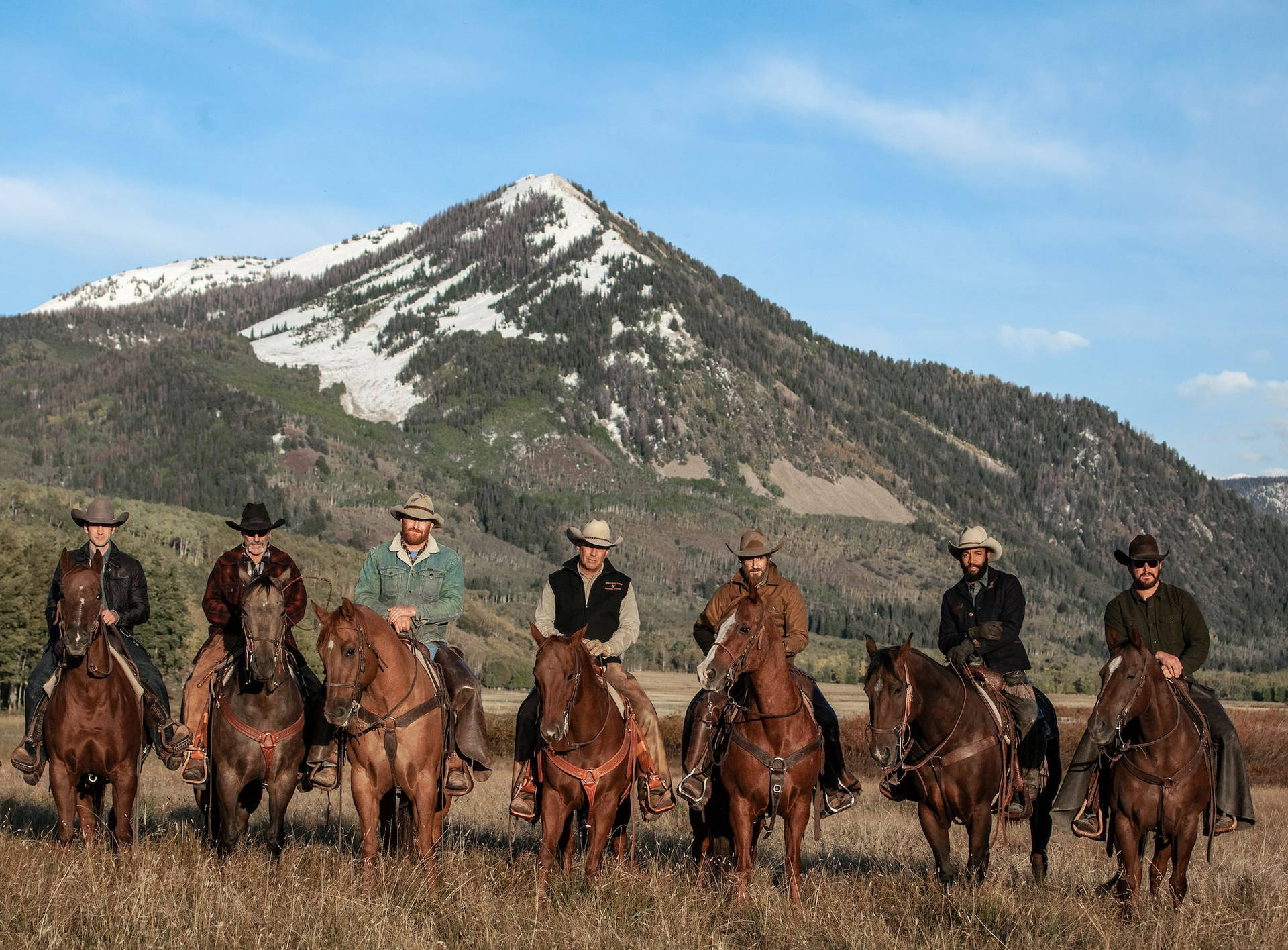 Yellowstone Tv Show Men In Horses Background