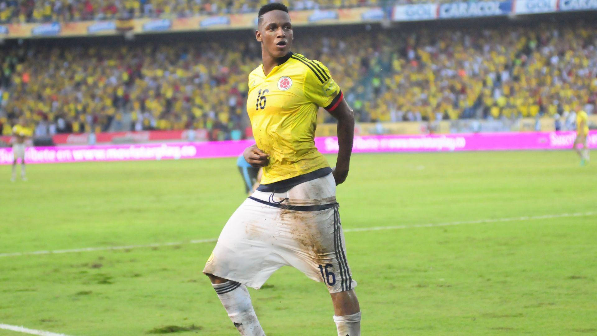 Yerry Mina In Yellow Jersey Background