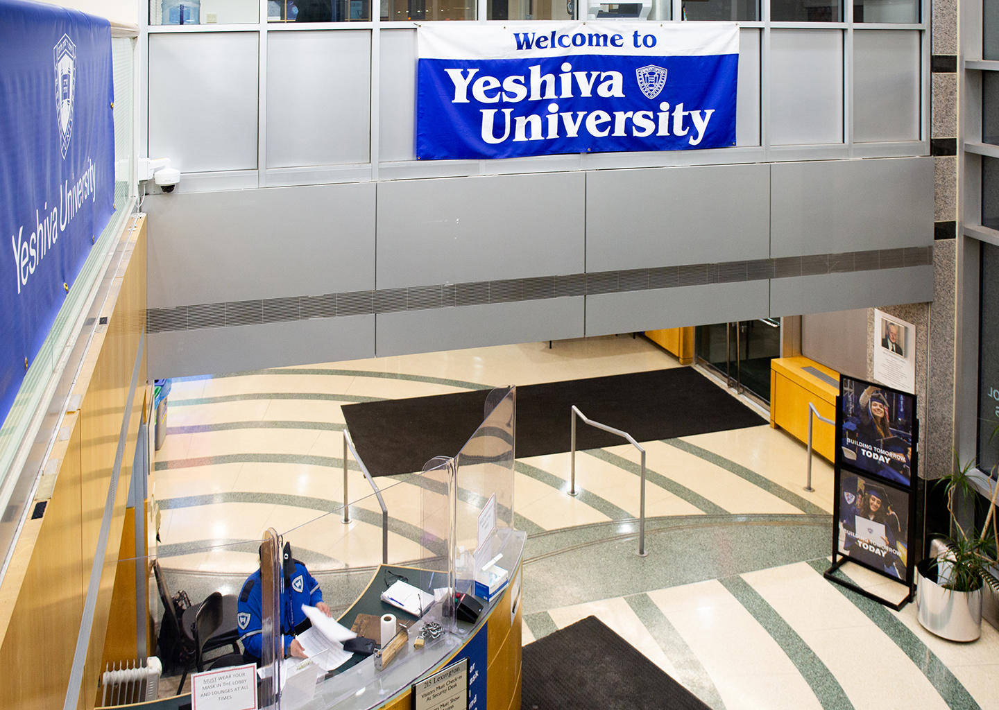 Yeshiva University Banner On Walkway Background