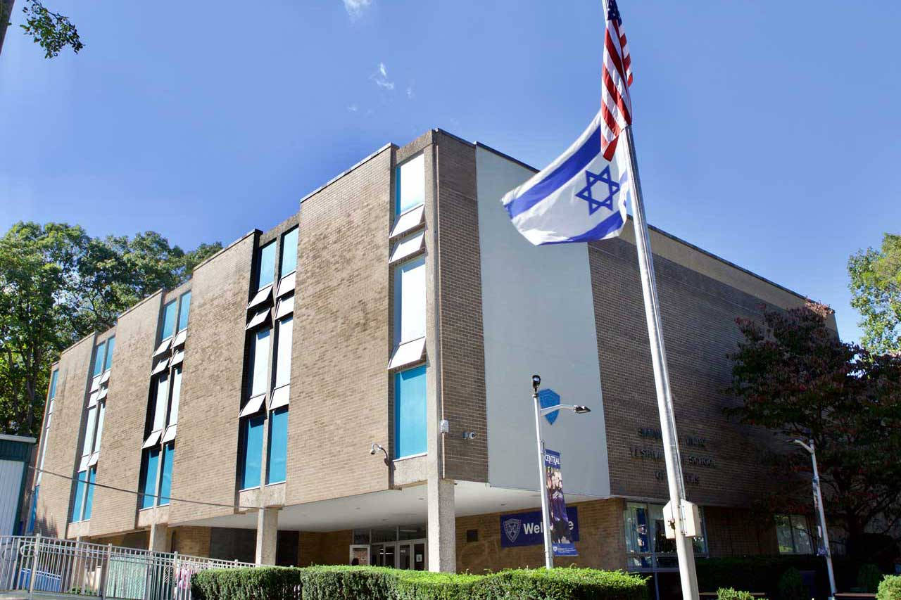 Yeshiva University Building With Flags Background