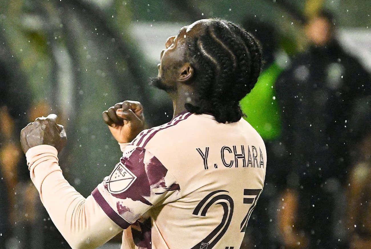 Yimmi Chara Celebrationin Rain Background