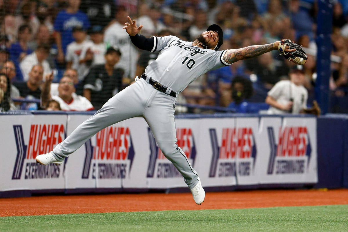 Yoan Moncada Jumping To Catch Ball Background