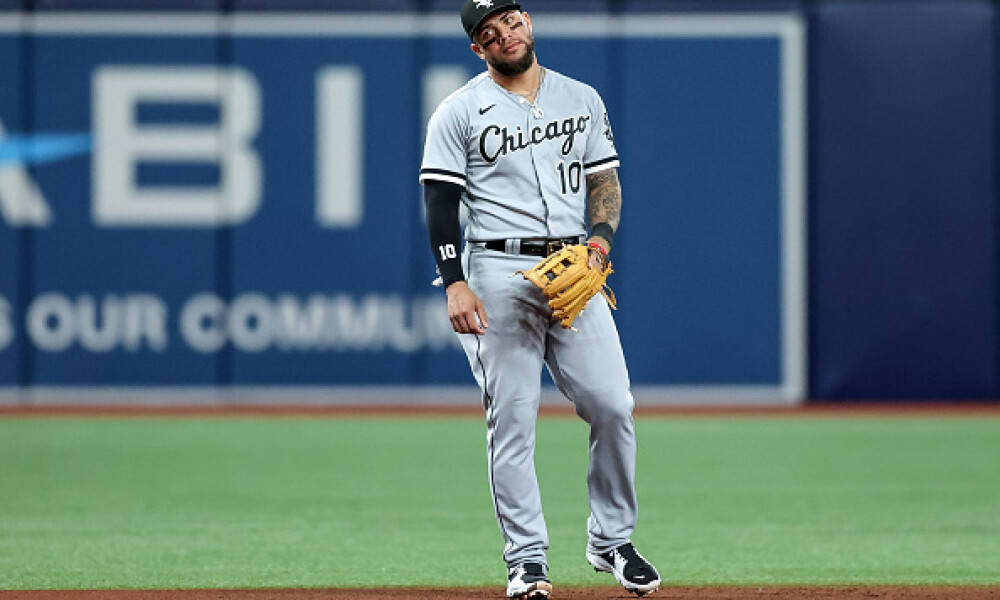 Yoan Moncada Standing On Baseball Field Background