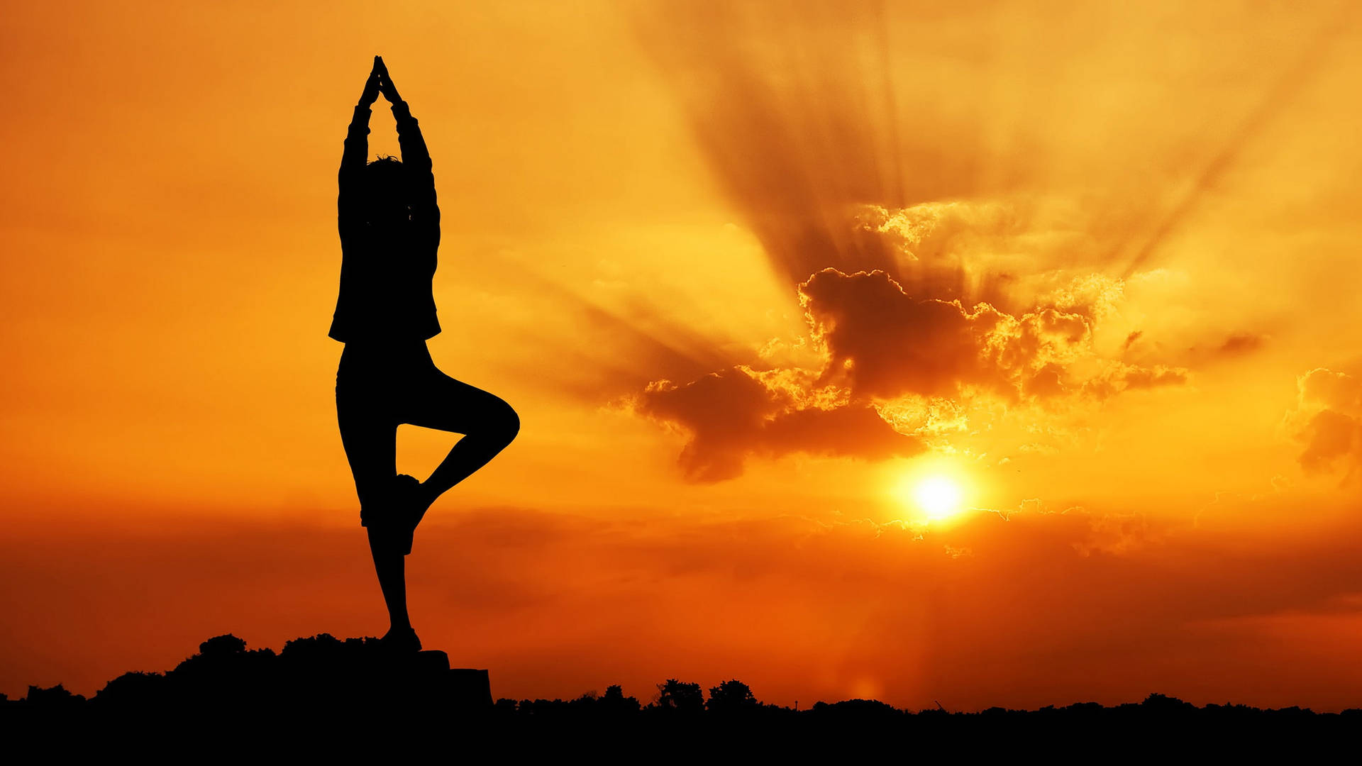 Yoga Pose Against Sunset Background