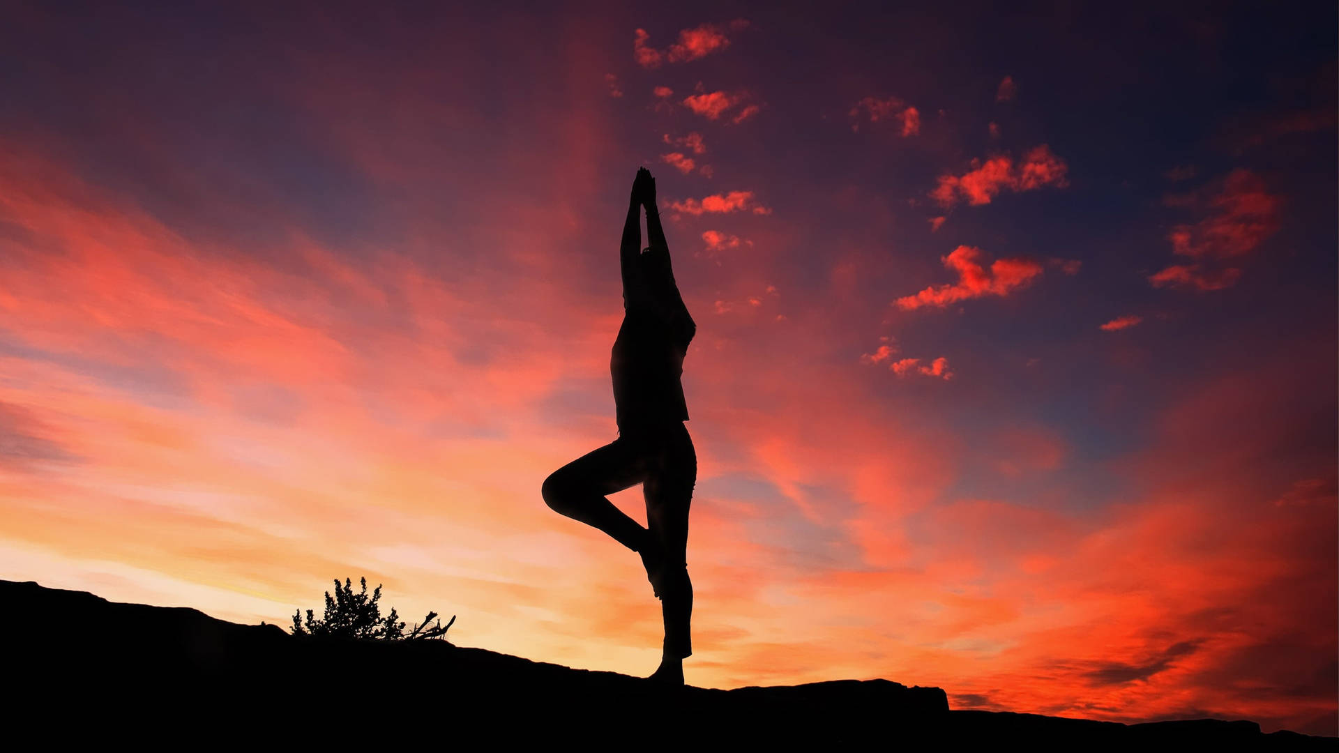 Yoga Stance Under Sunset Sky Background