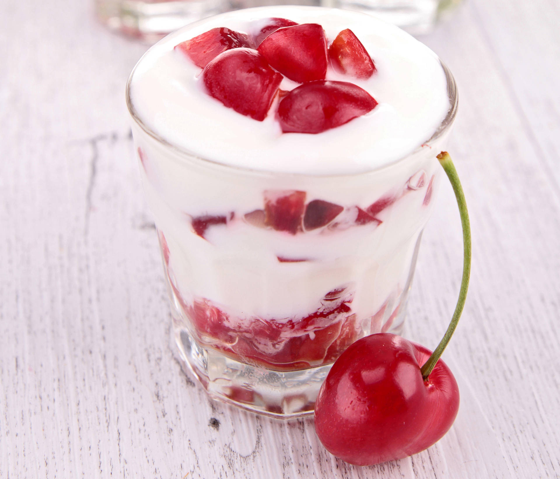 Yogurt Delight With Cherry Topping Background