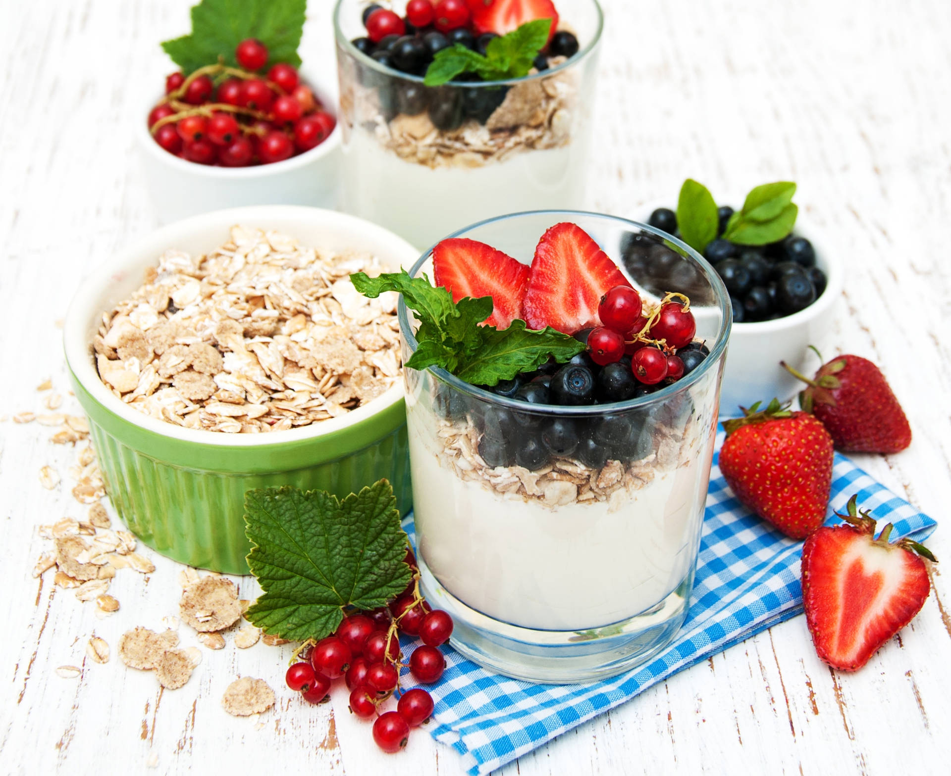 Yogurt Oatmeal With Berries Mint Leaves Background