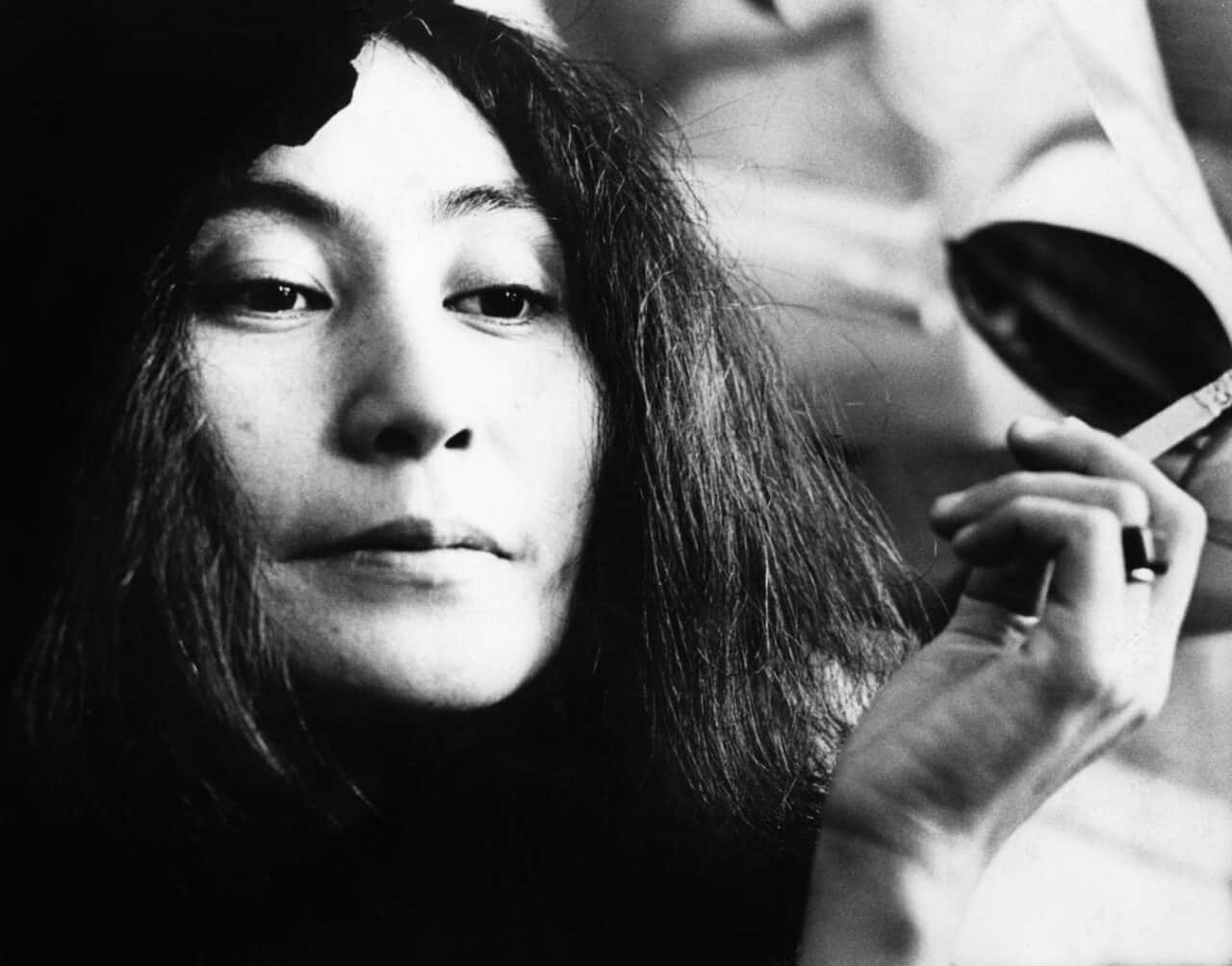 Yoko Ono Holding Cigarette Background