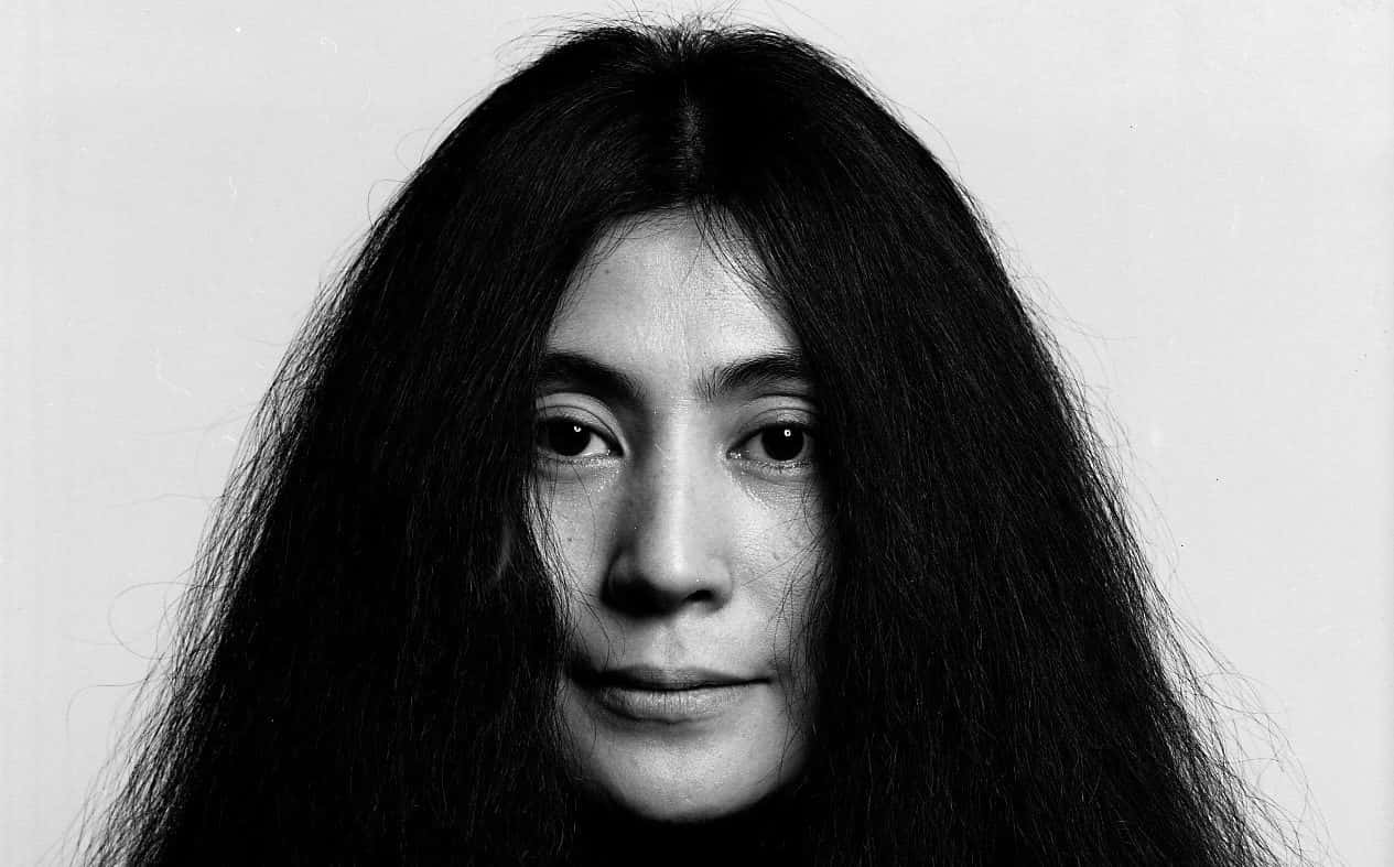 Yoko Ono, Iconic Artist And Activist, With Her Signature Long Hair Background