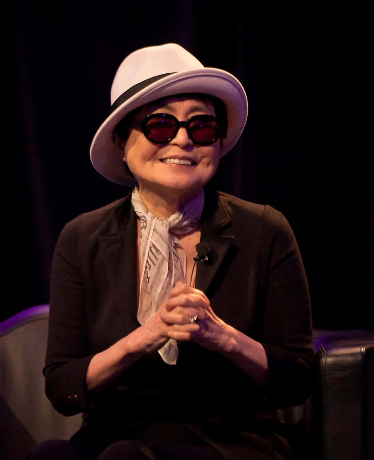 Yoko Ono Smiling Clasping Hands Background