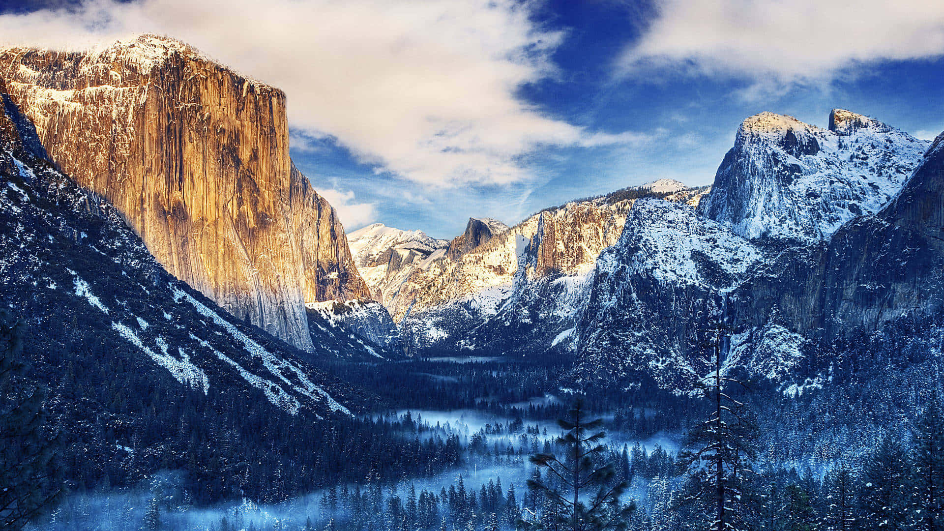 Yosemite Valley In Winter With Snow Covered Mountains Background