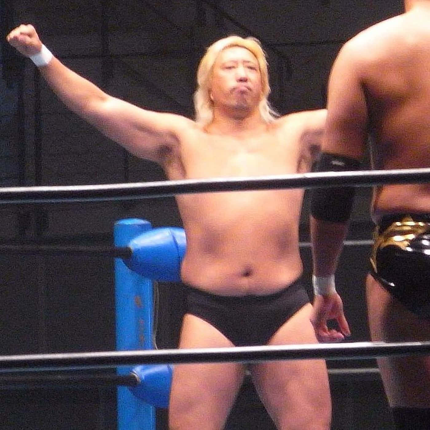 Yoshihiro Takayama Raising Arm Background