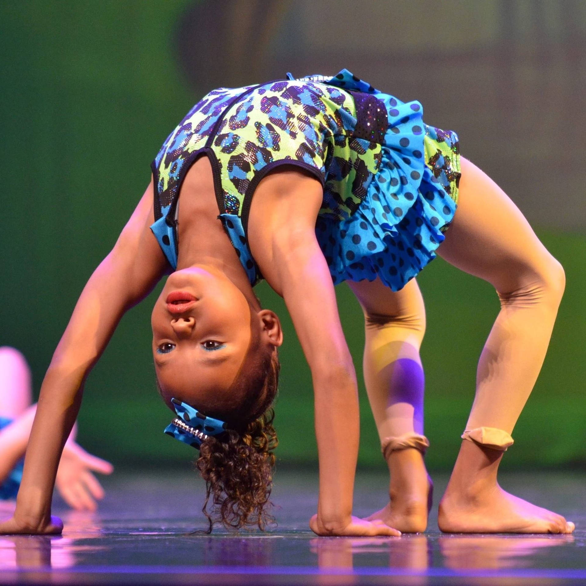 Young Athlete Demonstrates Pliability Background