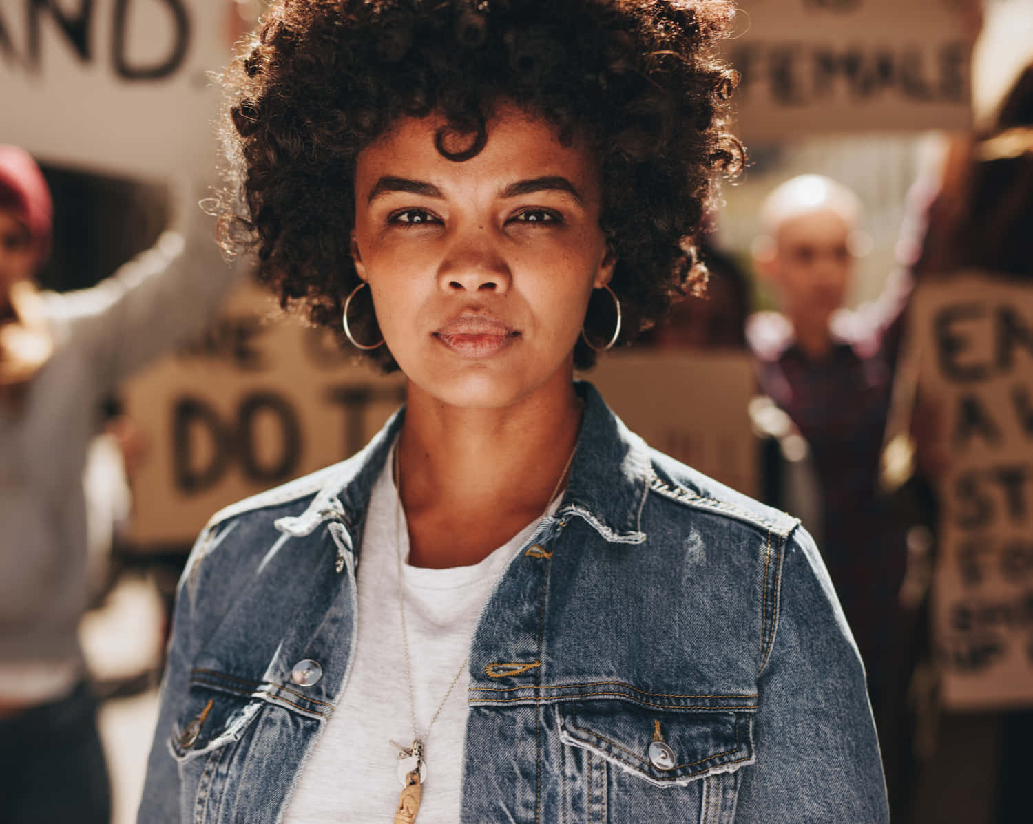 Young Black Woman Amidst Protesters