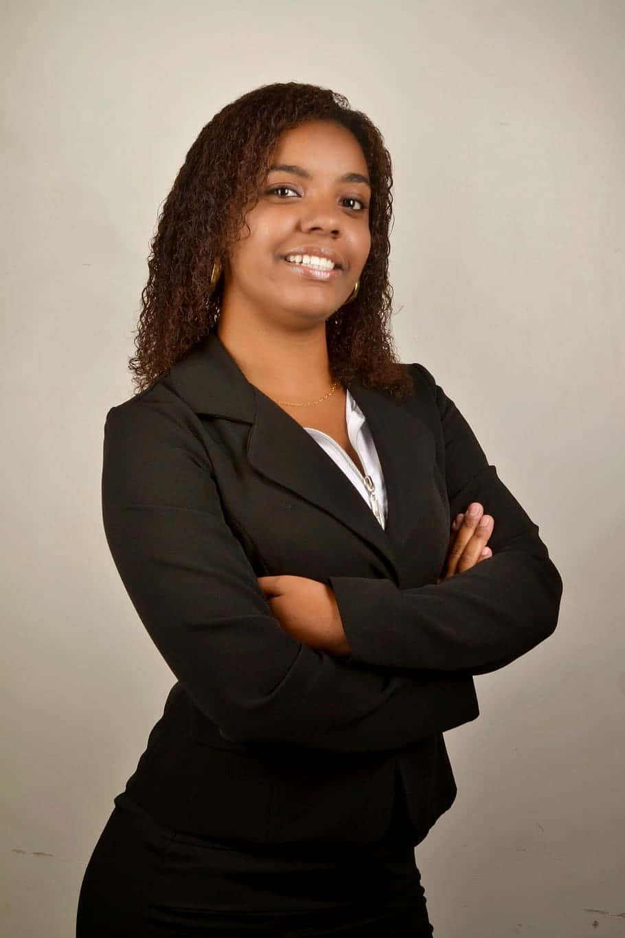 Young Black Woman Smile In Business Suit Background