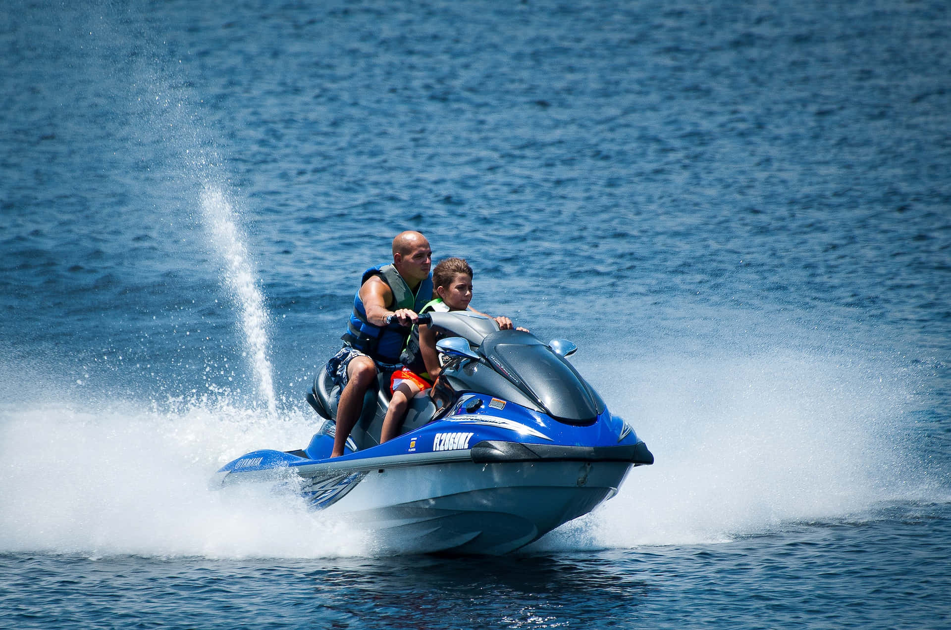 Young Boy Enjoying A Jet Ski Ride