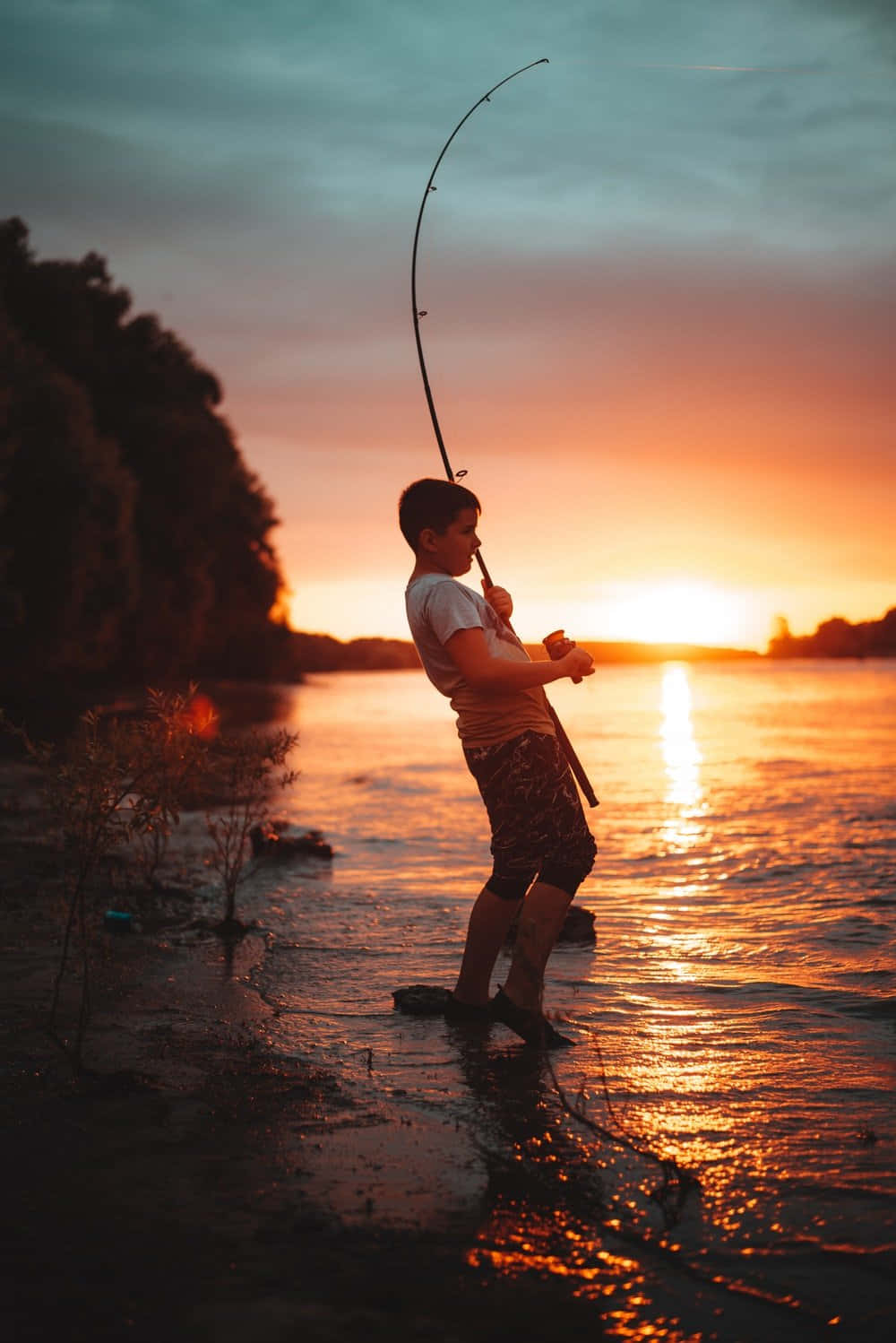 Young Boy Fishing Phone Theme Background