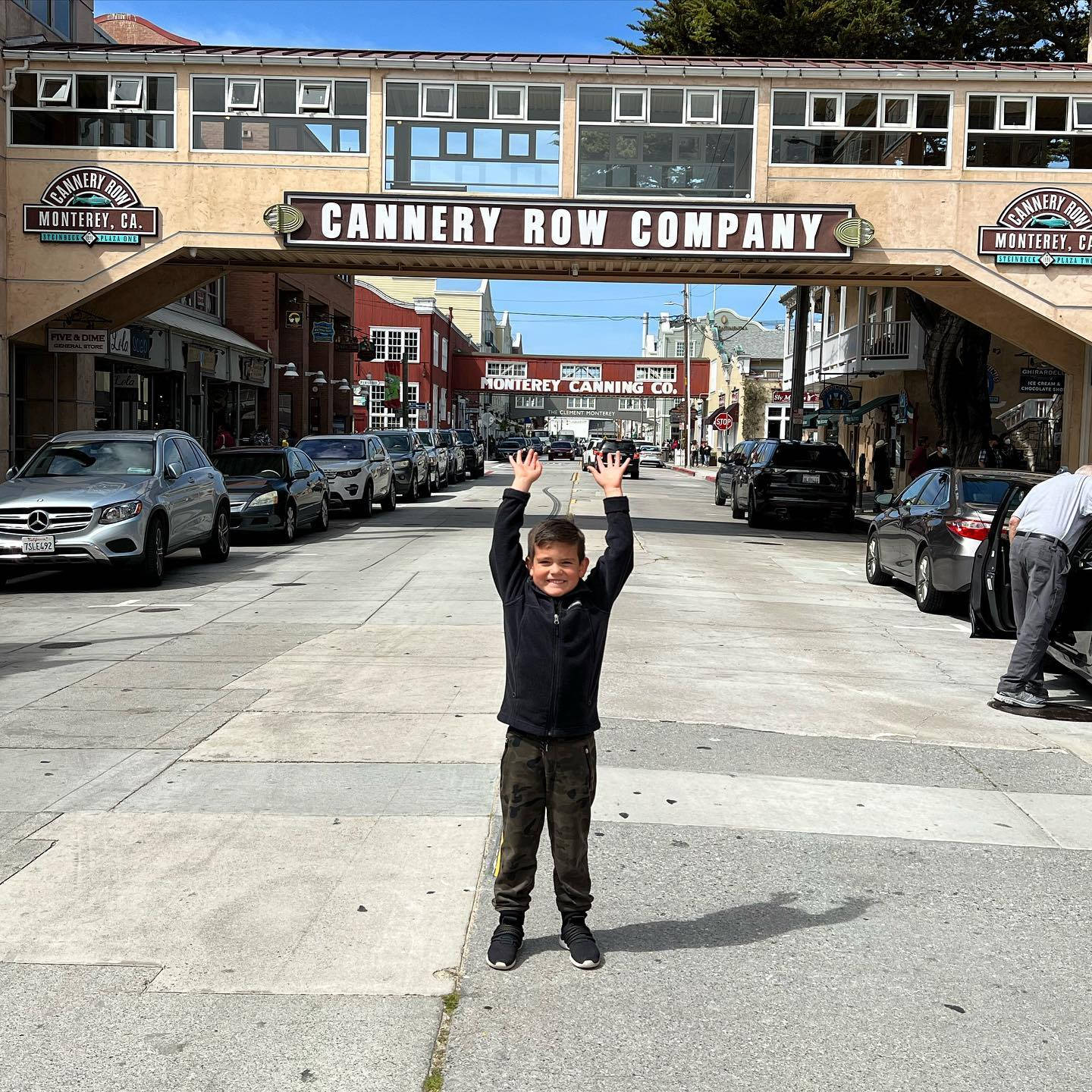 Young Boy In Cannery Row Background