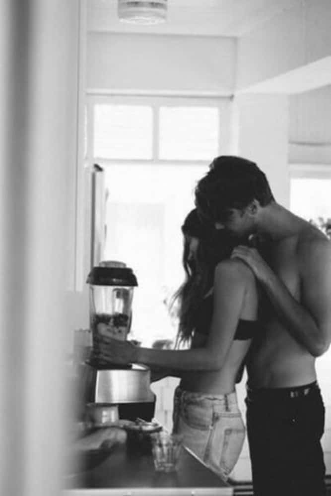 Young Couple Holding Hands And Walking Through A Park Background