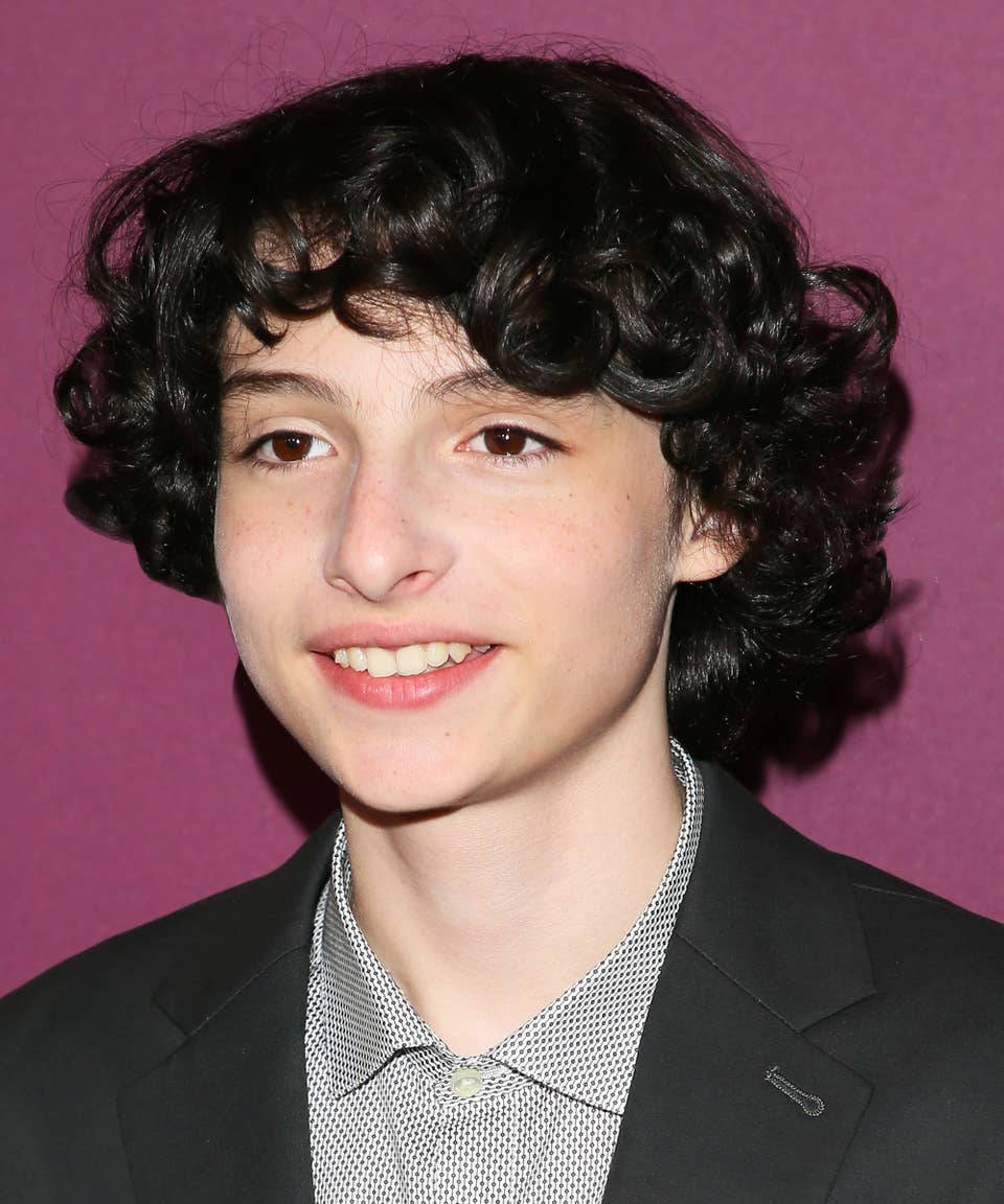 Young Curly-haired Finn Wolfhard Background