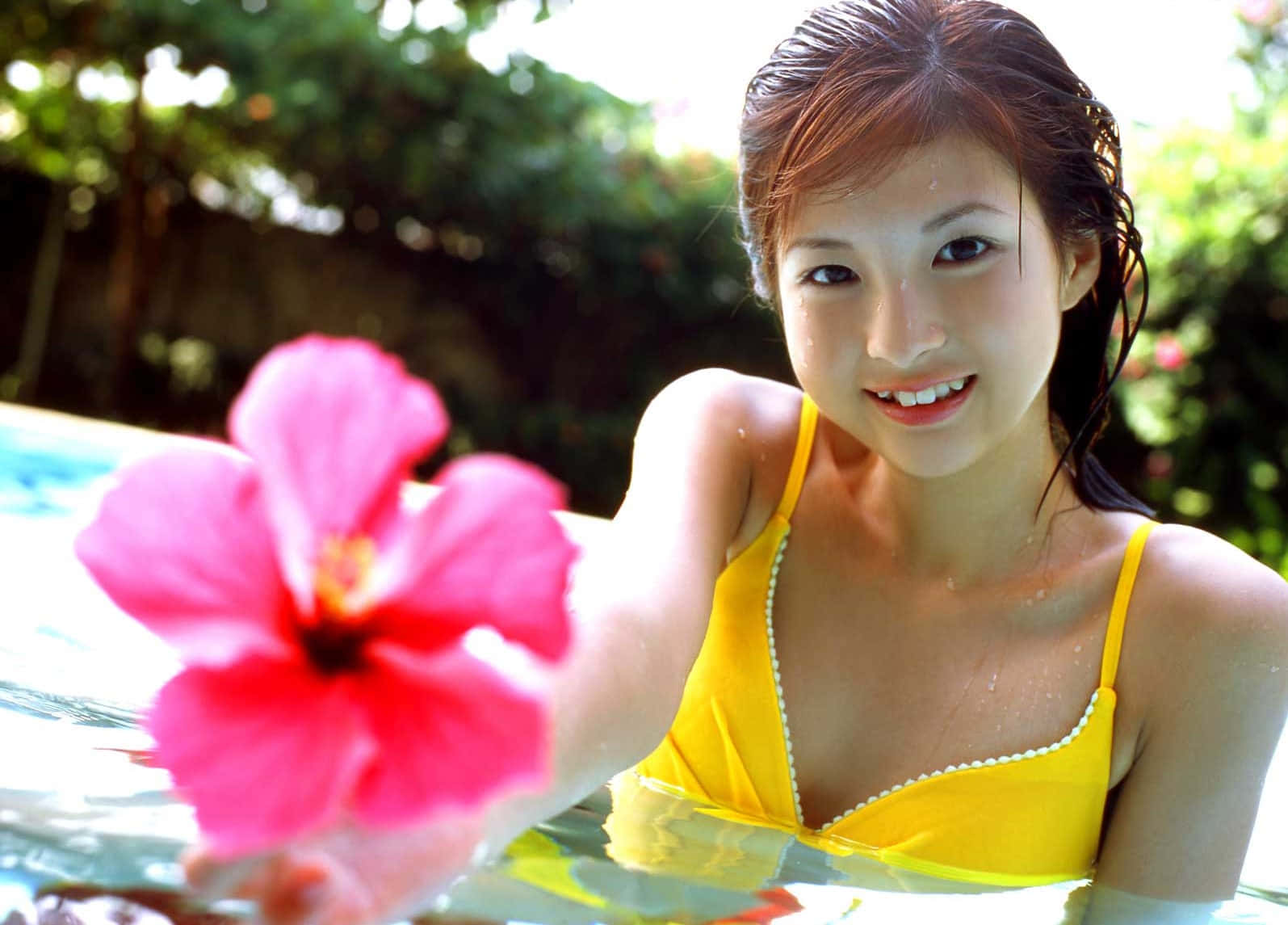 Young Female Model Holding Flower Background